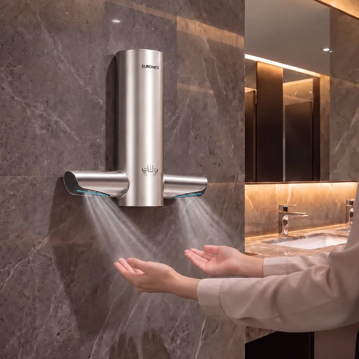 A Tornado hand dryer in a marble-clad washroom, in use